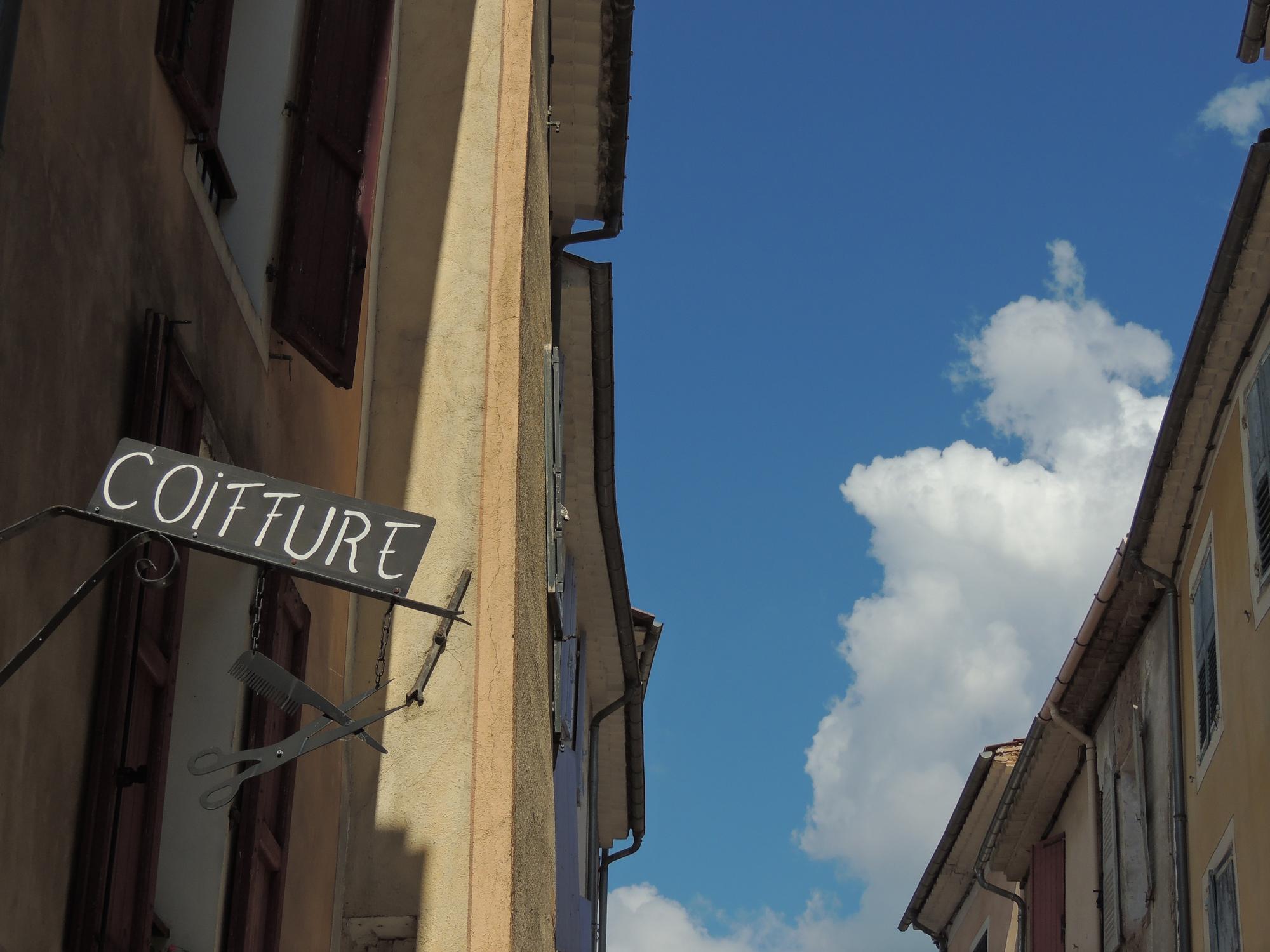 atelier exterior with subtle signage and natural light